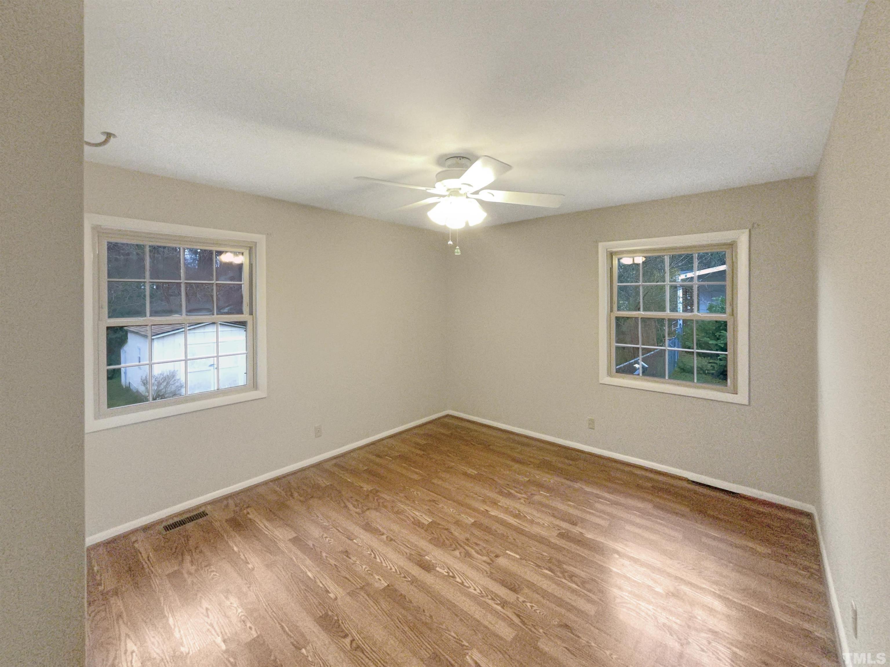 5333 Olive Road Raleigh, NC 27606 - Photo 13 of 18 a view of an empty room with windows