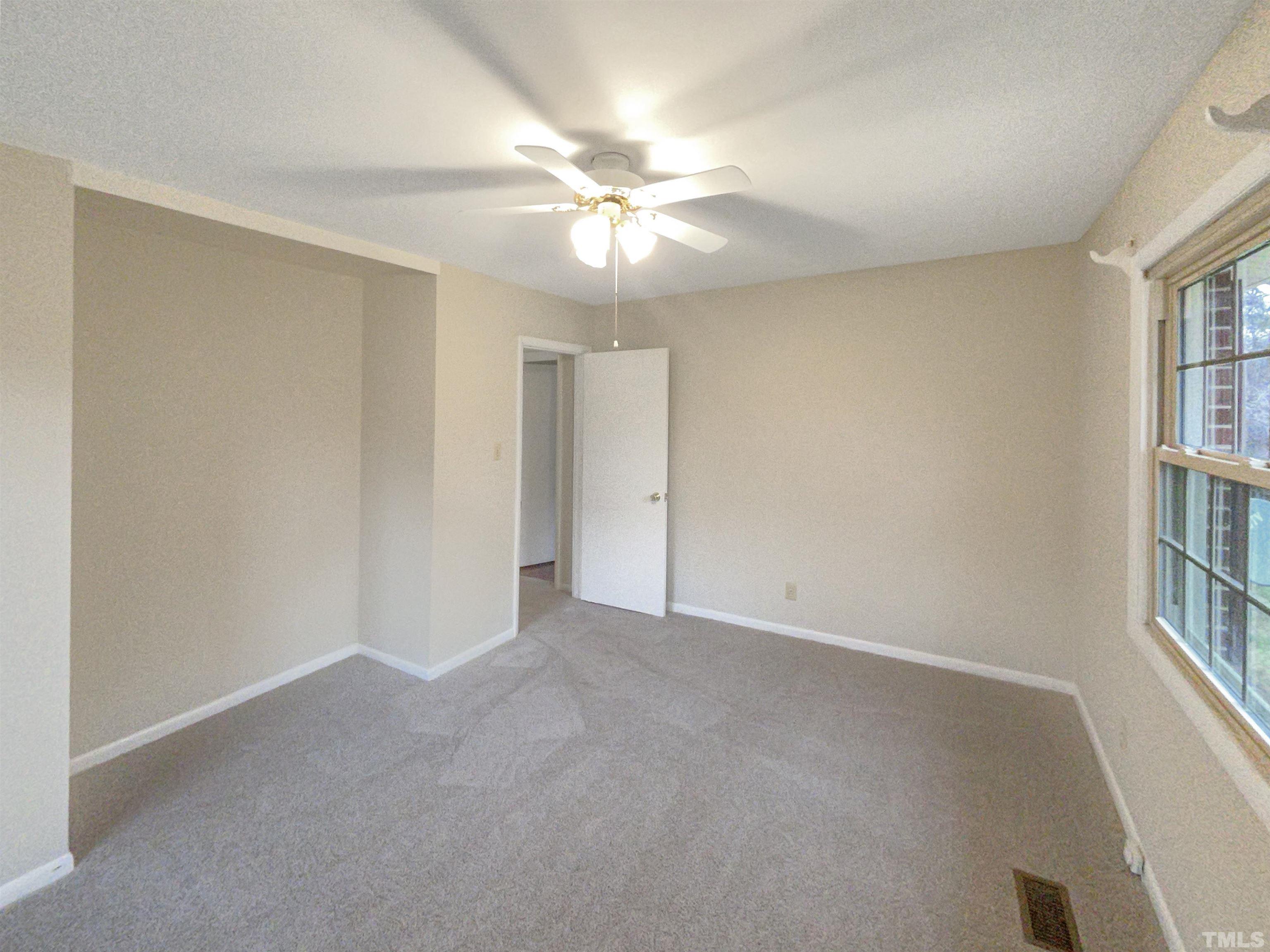 5333 Olive Road Raleigh, NC 27606 - Photo 16 of 18 a view of an empty room with a window