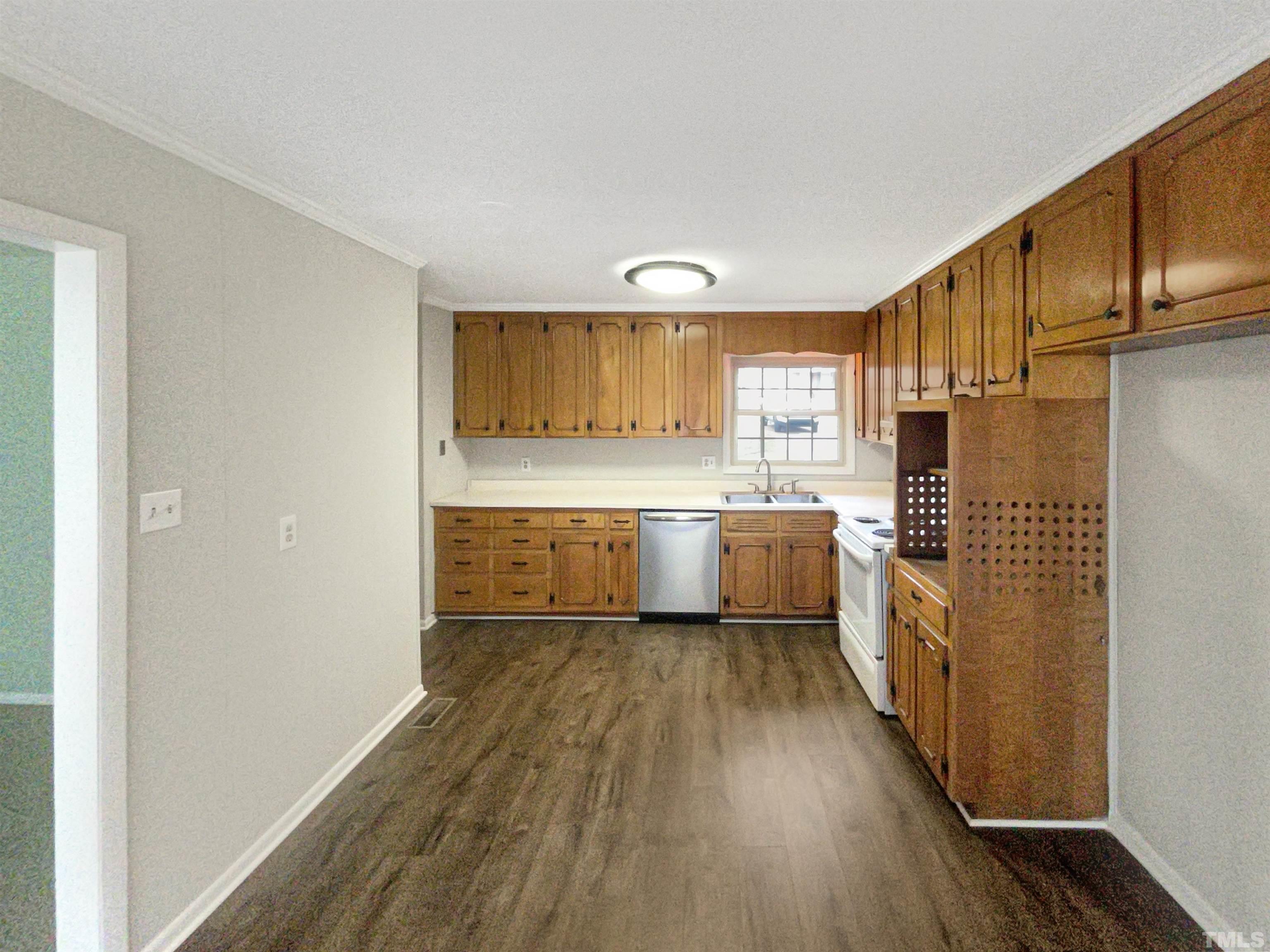 5333 Olive Road Raleigh, NC 27606 - Photo 2 of 18 a view of a kitchen with wooden floor and electronic appliances