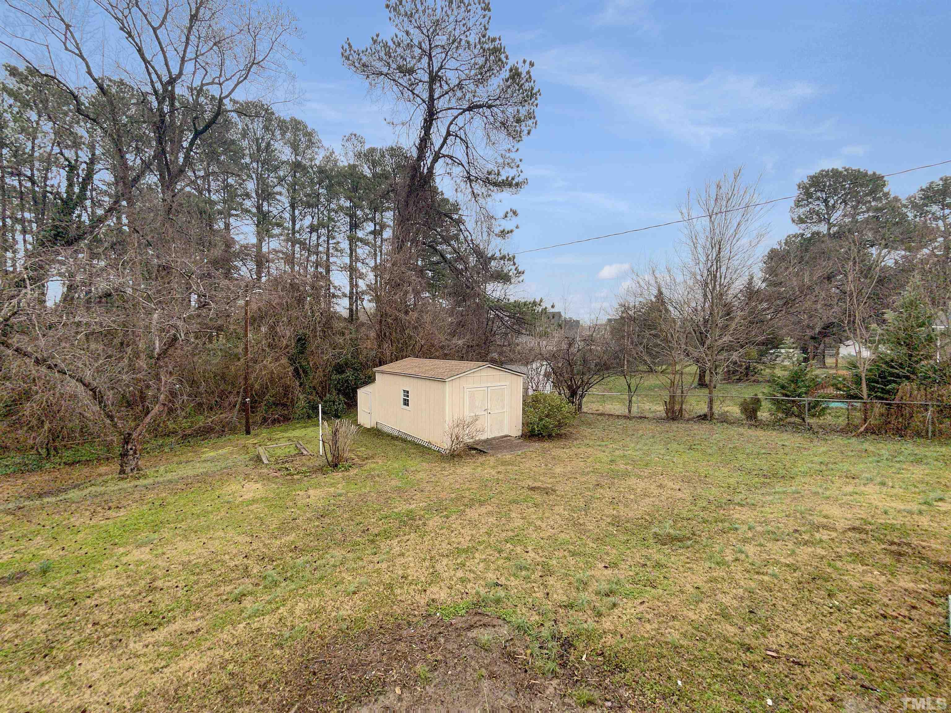 5333 Olive Road Raleigh, NC 27606 - Photo 6 of 18 a white house that has a tree in front of it