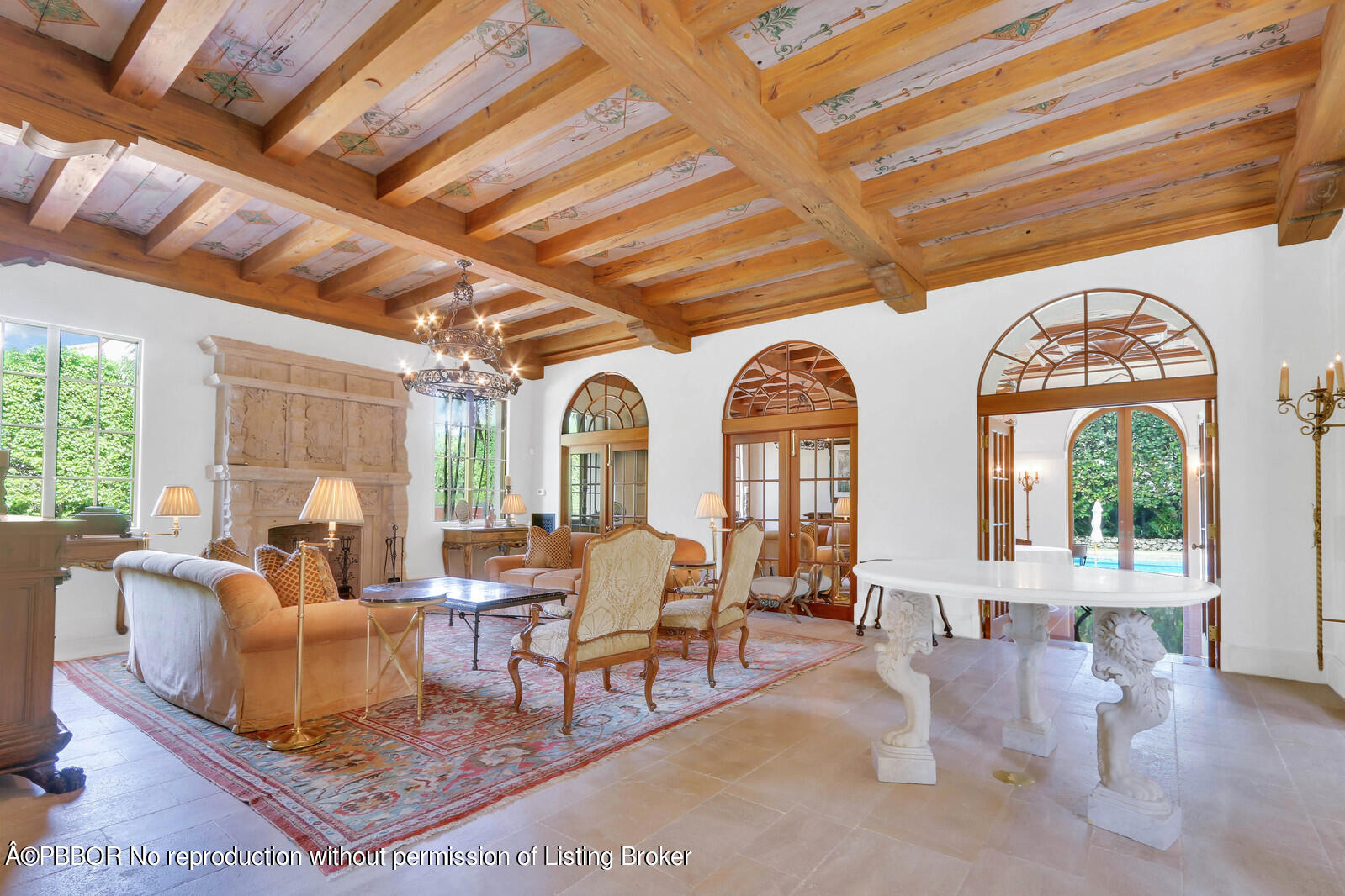 120 Jungle Road Palm Beach, FL 33480 - Photo 11 of 21 a living room with couches a large dining table and large windows with wooden floor