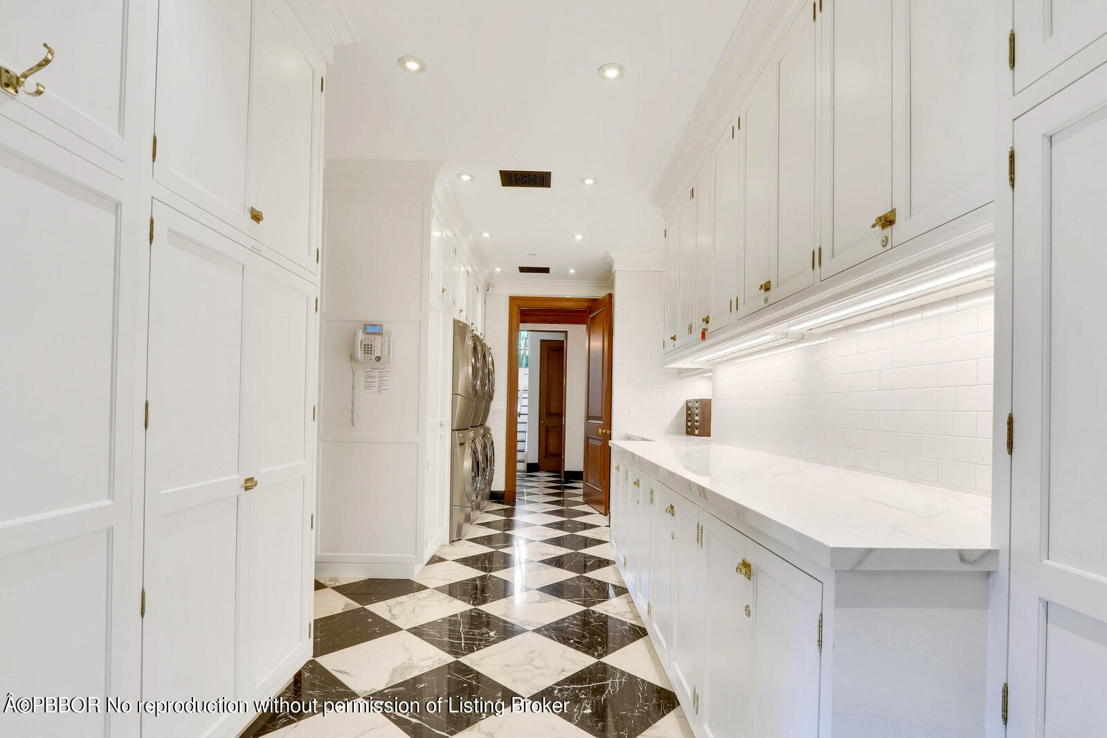 120 Jungle Road Palm Beach, FL 33480 - Photo 20 of 21 a hallway with windows and chandelier