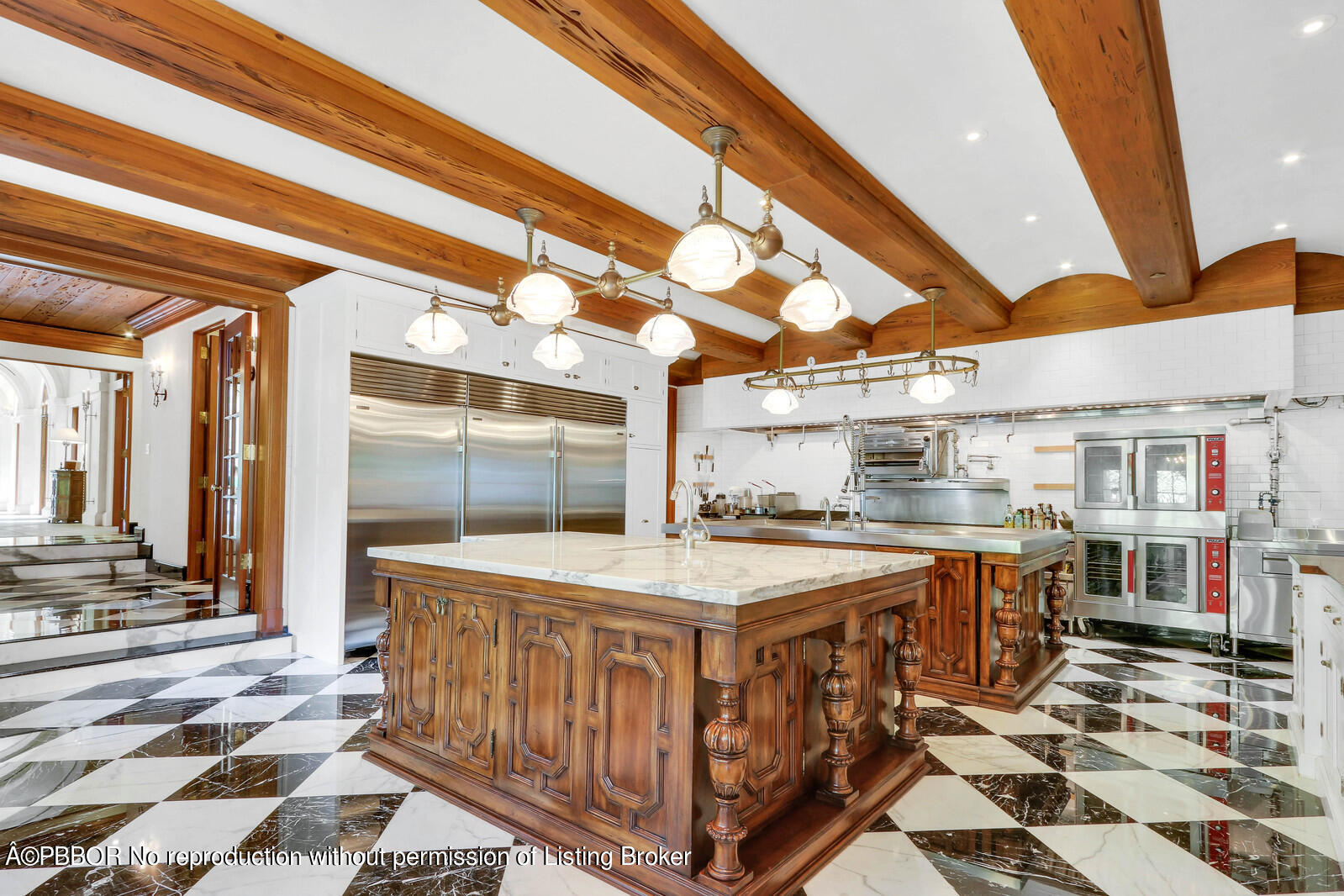 120 Jungle Road Palm Beach, FL 33480 - Photo 8 of 21 a utility room with stainless steel appliances granite countertop a sink and cabinets