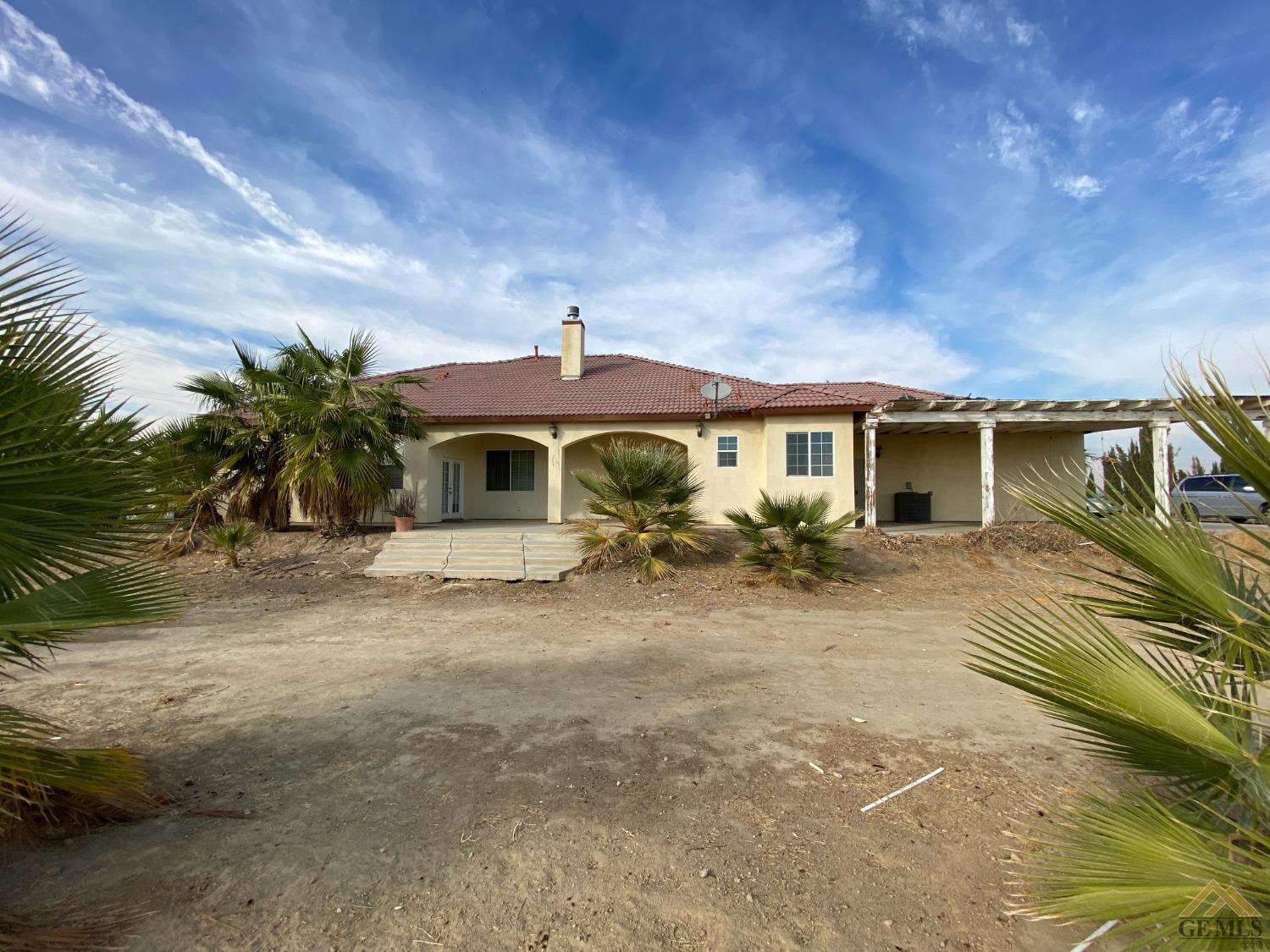 Undisclosed Address Bakersfield, CA 93307 - Photo 30 of 36 a front view of a house with a yard