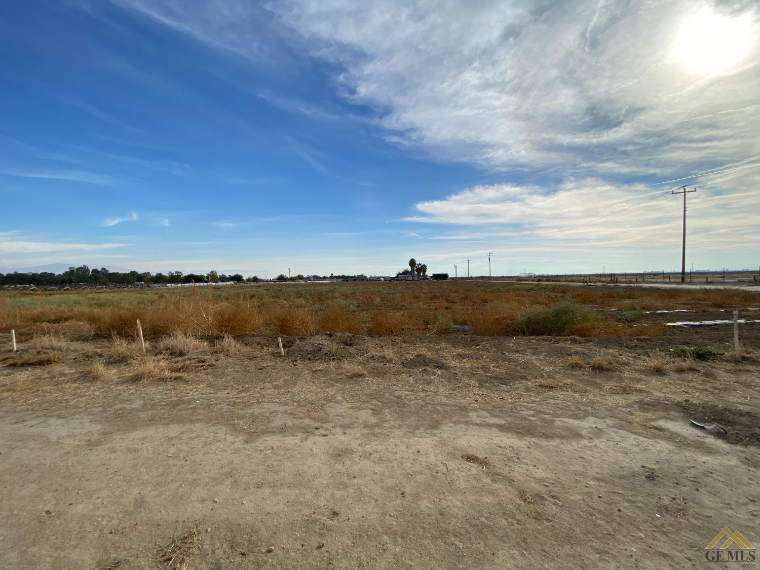 Undisclosed Address Bakersfield, CA 93307 - Photo 32 of 36 a view of a lake with a city