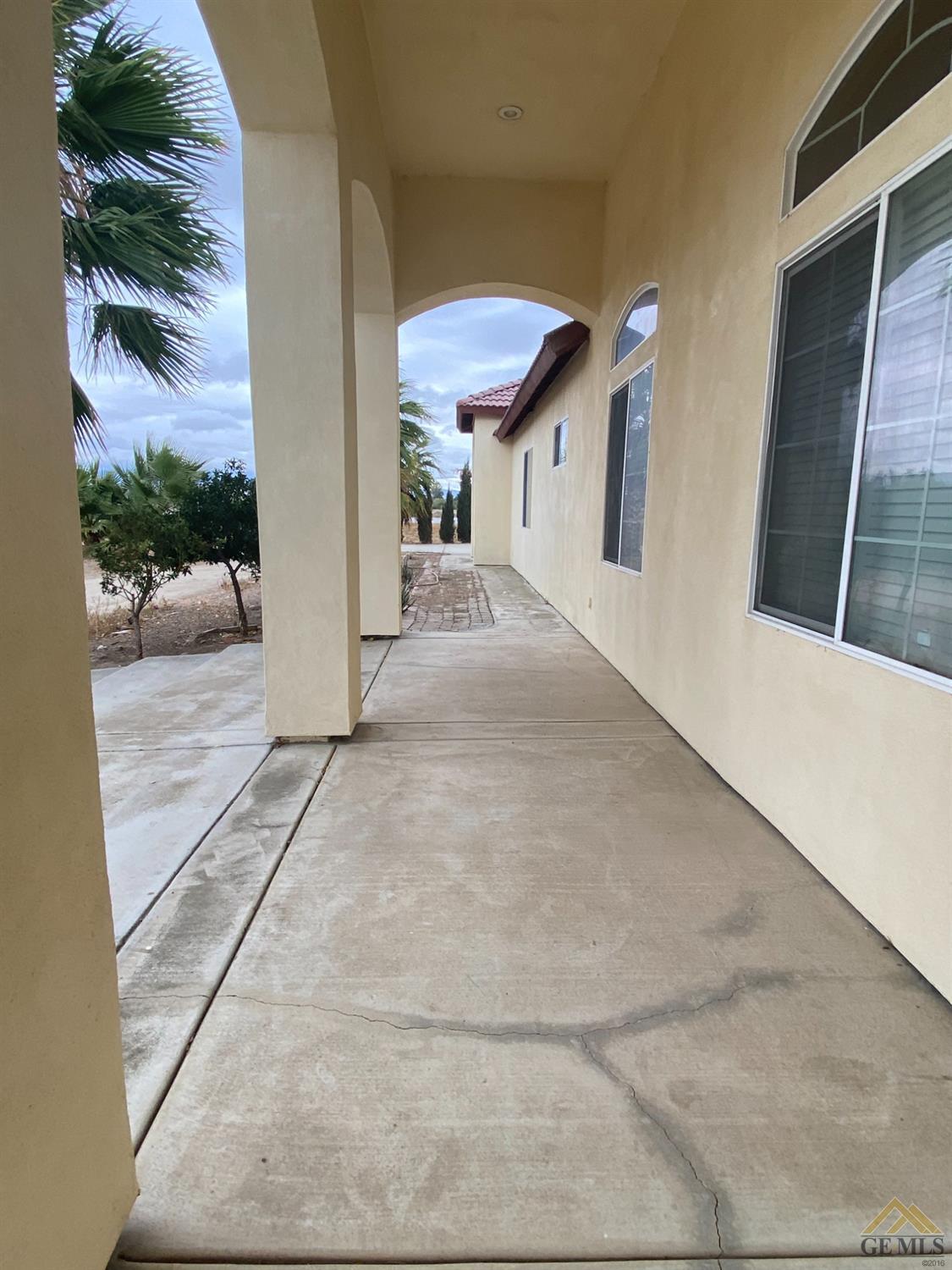 Undisclosed Address Bakersfield, CA 93307 - Photo 4 of 36 a view of a living room and a garage