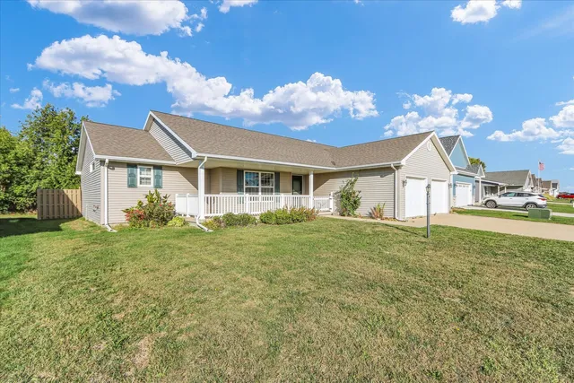 a view of a house with a backyard