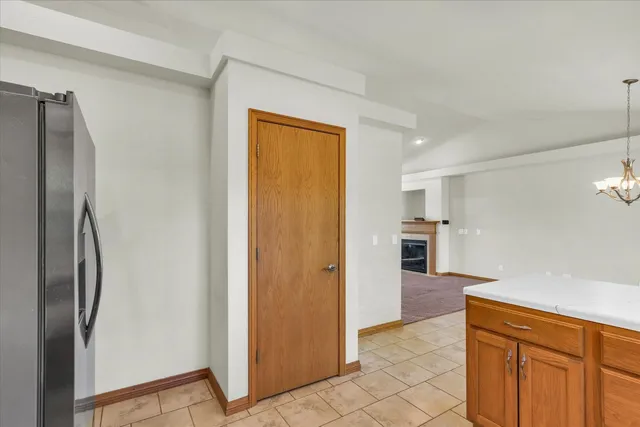 a view of hallway with cabinets