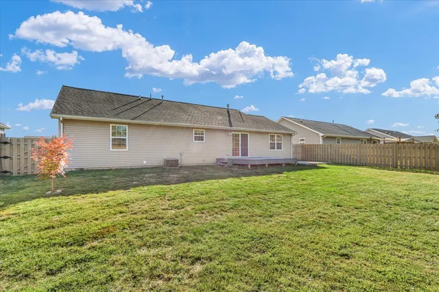 a view of a house with backyard and garden