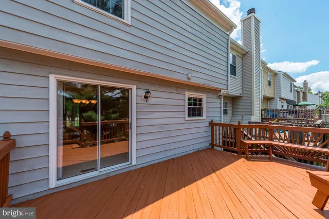 a balcony with furniture and a potted plant