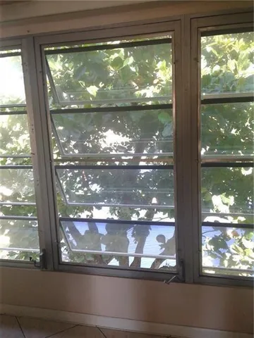 a view of a lake with a building in the background