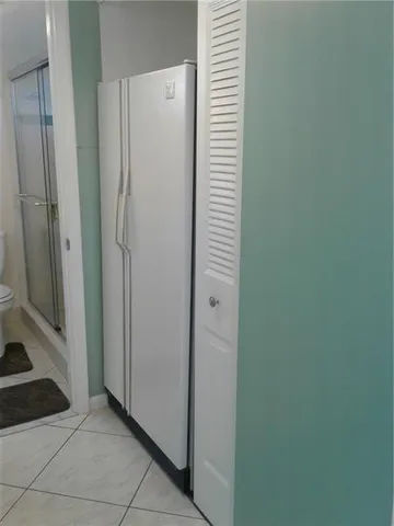 a view of a bathroom with a sink and a mirror