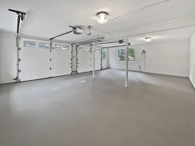 a house that has a tree in front of it