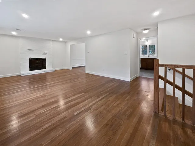 a bathroom with a granite countertop toilet sink and shower