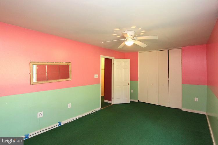 9282 Adelphi Road, Unit 102 Hyattsville, MD 20783 - Photo 14 of 29 a view of a room that has a window and a fan