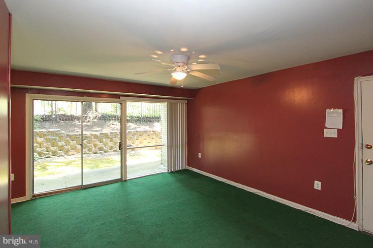 9282 Adelphi Road, Unit 102 Hyattsville, MD 20783 - Photo 16 of 29 a view of an empty room with a window