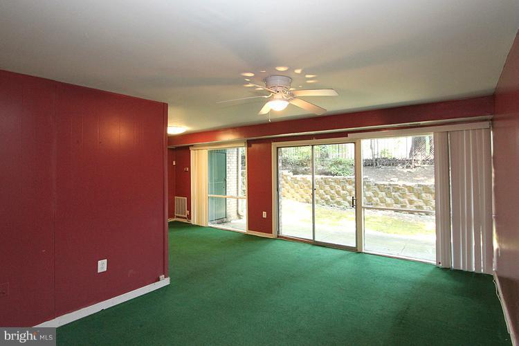 9282 Adelphi Road, Unit 102 Hyattsville, MD 20783 - Photo 22 of 29 a view of an empty room with a window
