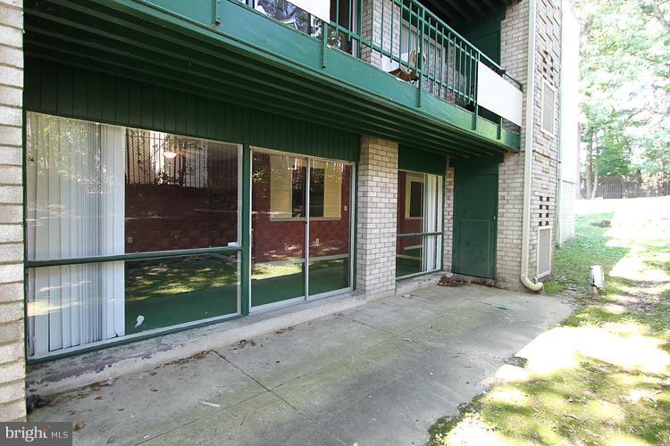 9282 Adelphi Road, Unit 102 Hyattsville, MD 20783 - Photo 8 of 29 a view of a house with a large window and wooden fence