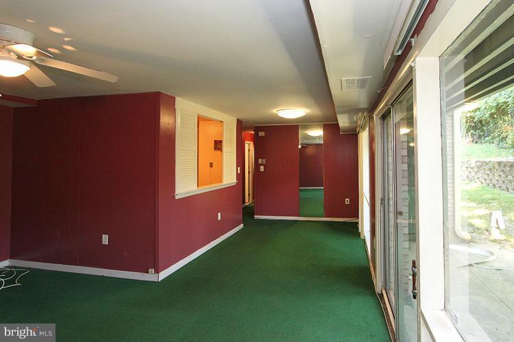 9282 Adelphi Road, Unit 102 Hyattsville, MD 20783 - Photo 10 of 29 a view of an empty room with a window