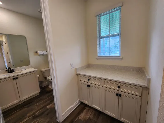 a view of a lake with houses in the back