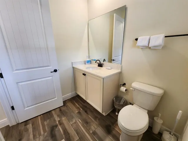 a view of an empty room with a fireplace