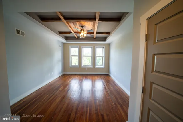 a view of wooden floor in an empty room