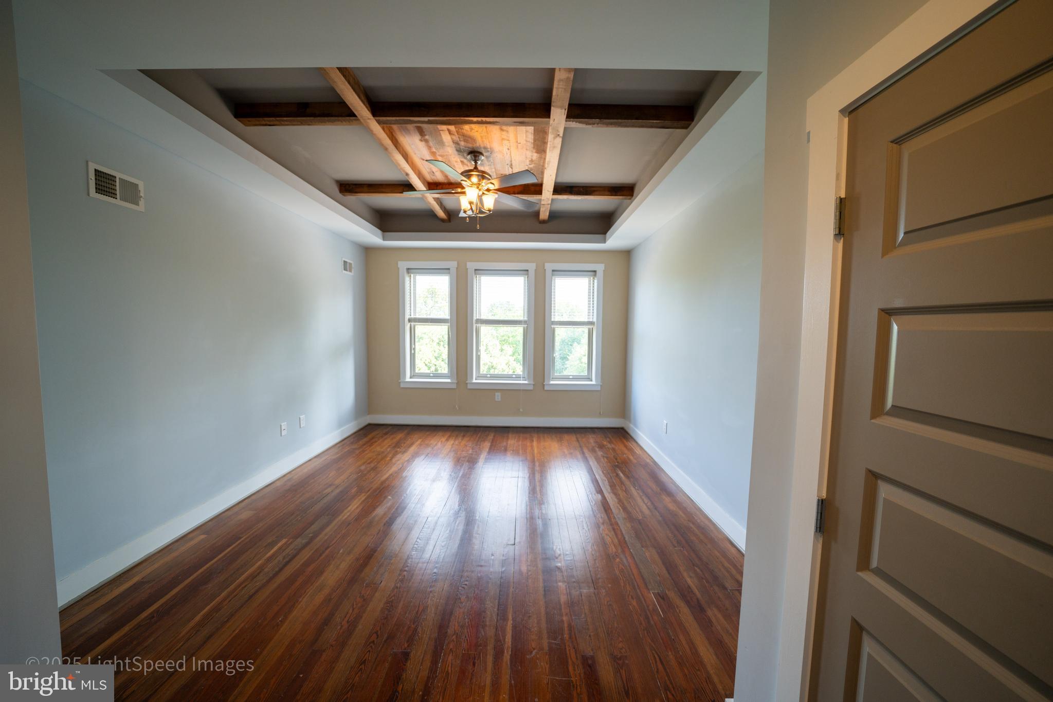 2730 East Baltimore Street Baltimore, MD 21224 - Photo 13 of 40 wooden floor in an empty room with a window