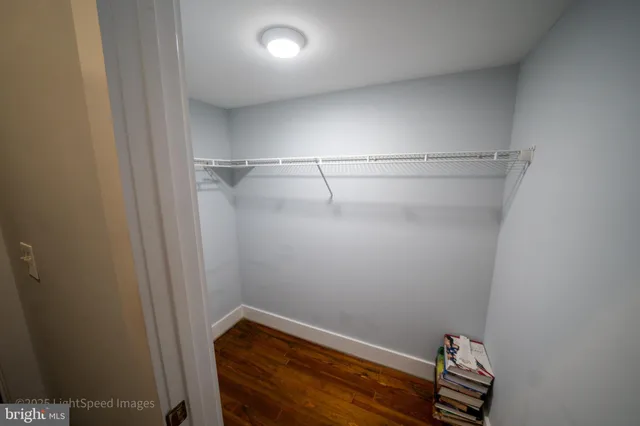 a bathroom with a sink a toilet a mirror and shower