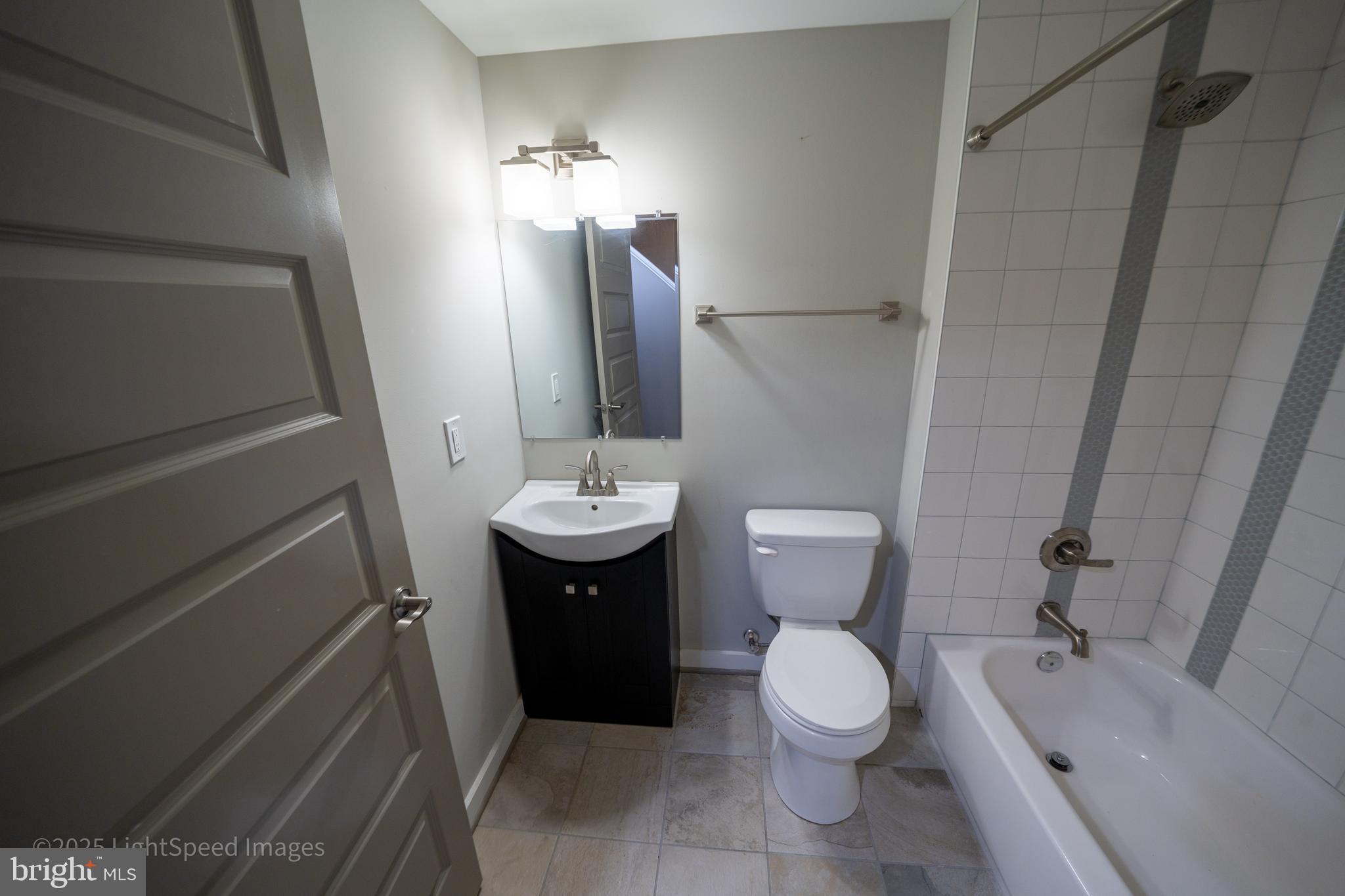 2730 East Baltimore Street Baltimore, MD 21224 - Photo 24 of 40 a bathroom with a sink toilet and shower