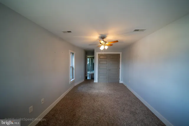 a room with furniture and wooden floor