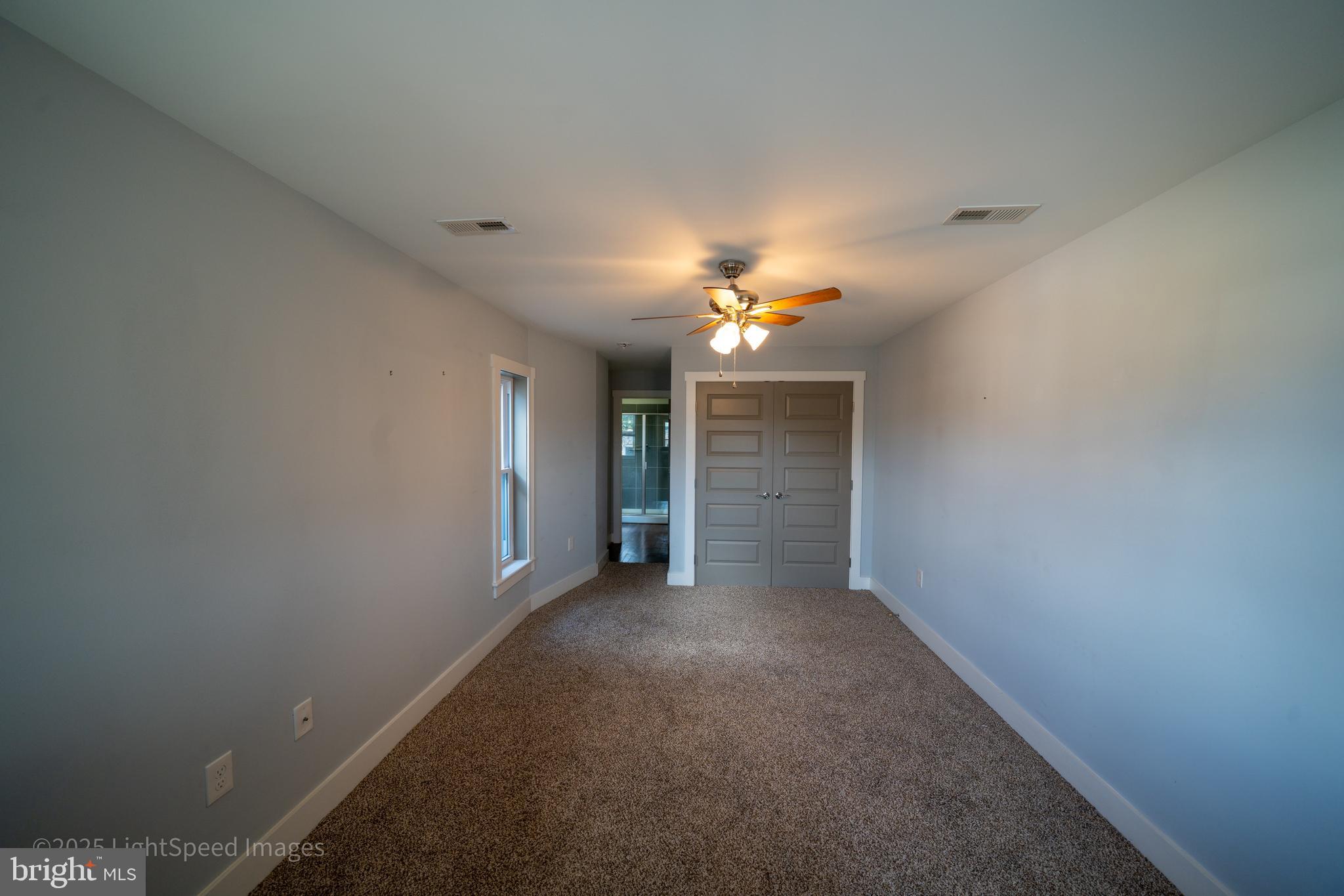 2730 East Baltimore Street Baltimore, MD 21224 - Photo 35 of 40 a view of an empty room with a chandelier fan