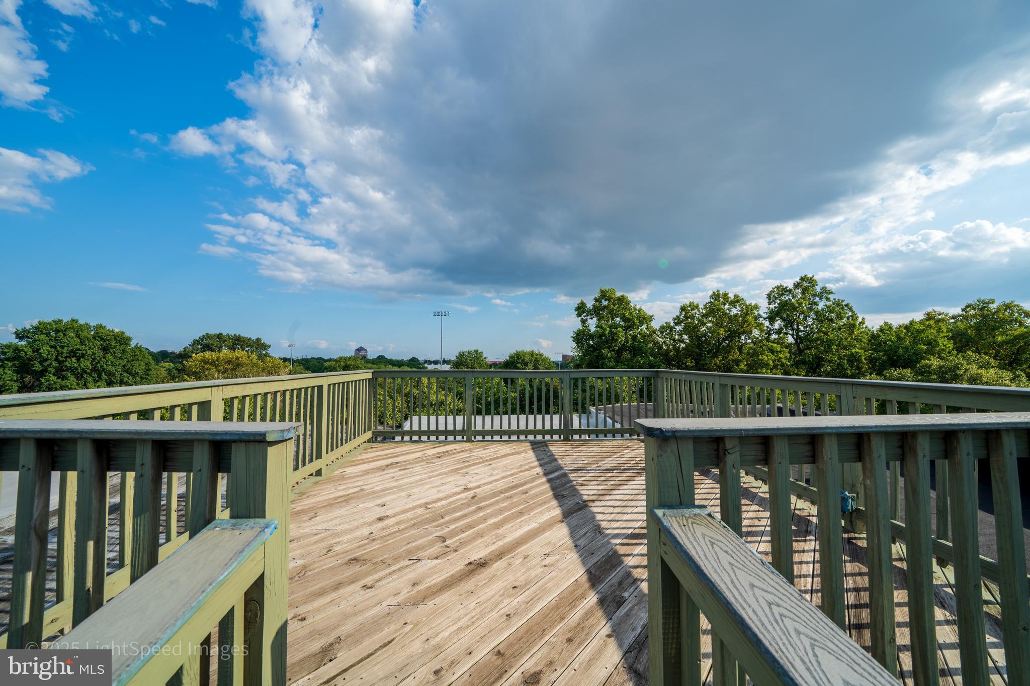 2730 East Baltimore Street Baltimore, MD 21224 - Photo 38 of 40 a balcony with wooden floor and lake view