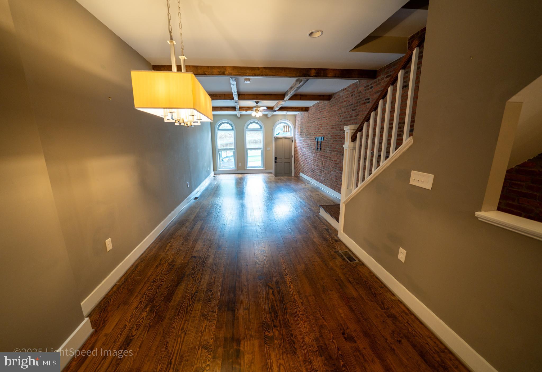 2730 East Baltimore Street Baltimore, MD 21224 - Photo 7 of 40 a view of a hallway with wooden floor
