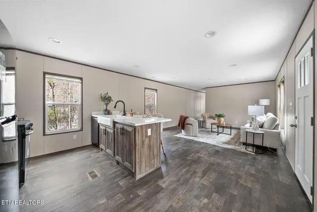 a view of living room filled with furniture and window