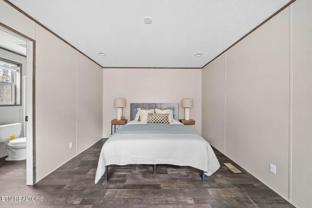 a room with a bed and a table in it