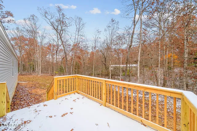 a view of balcony with wooden fence