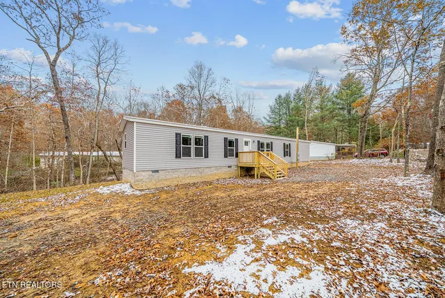 a house with trees in front of it