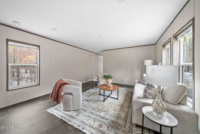 a work room with furniture and wooden floor