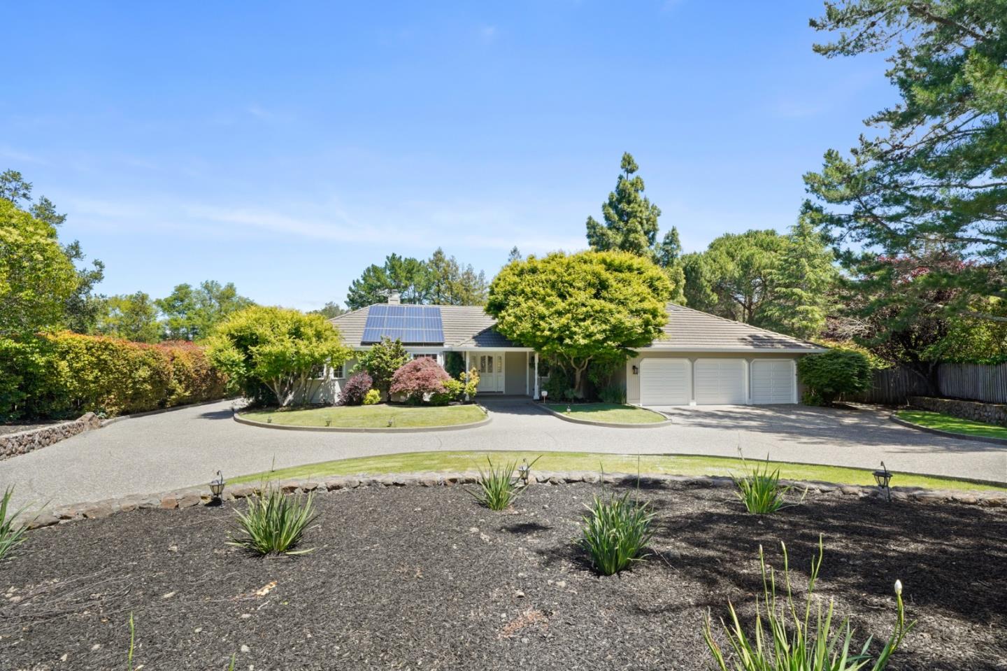 15 Debes Ranch Road San Rafael, CA 94903 - Photo 1 of 45 a front view of a house with a yard and garage