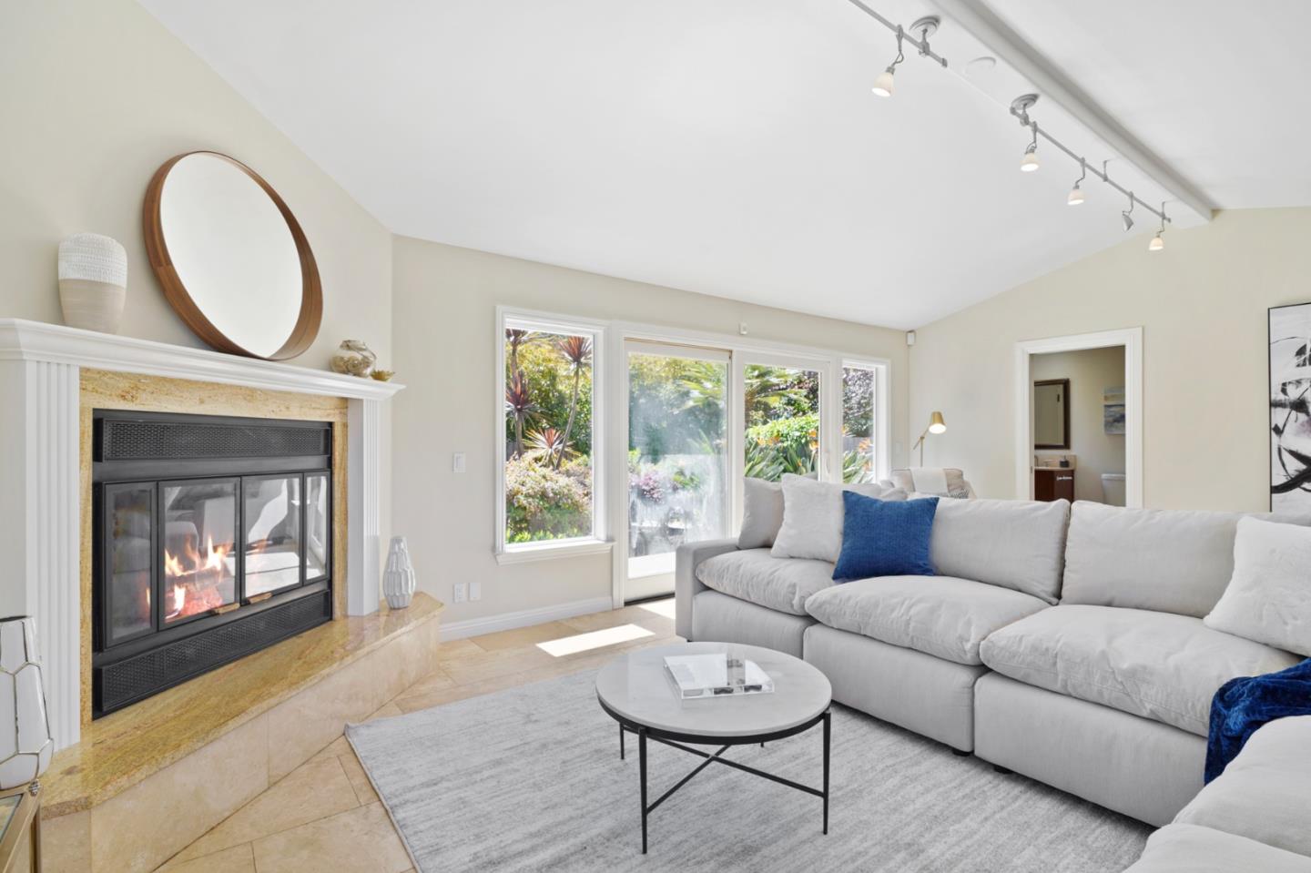 15 Debes Ranch Road San Rafael, CA 94903 - Photo 12 of 45 a living room with furniture a fireplace and window
