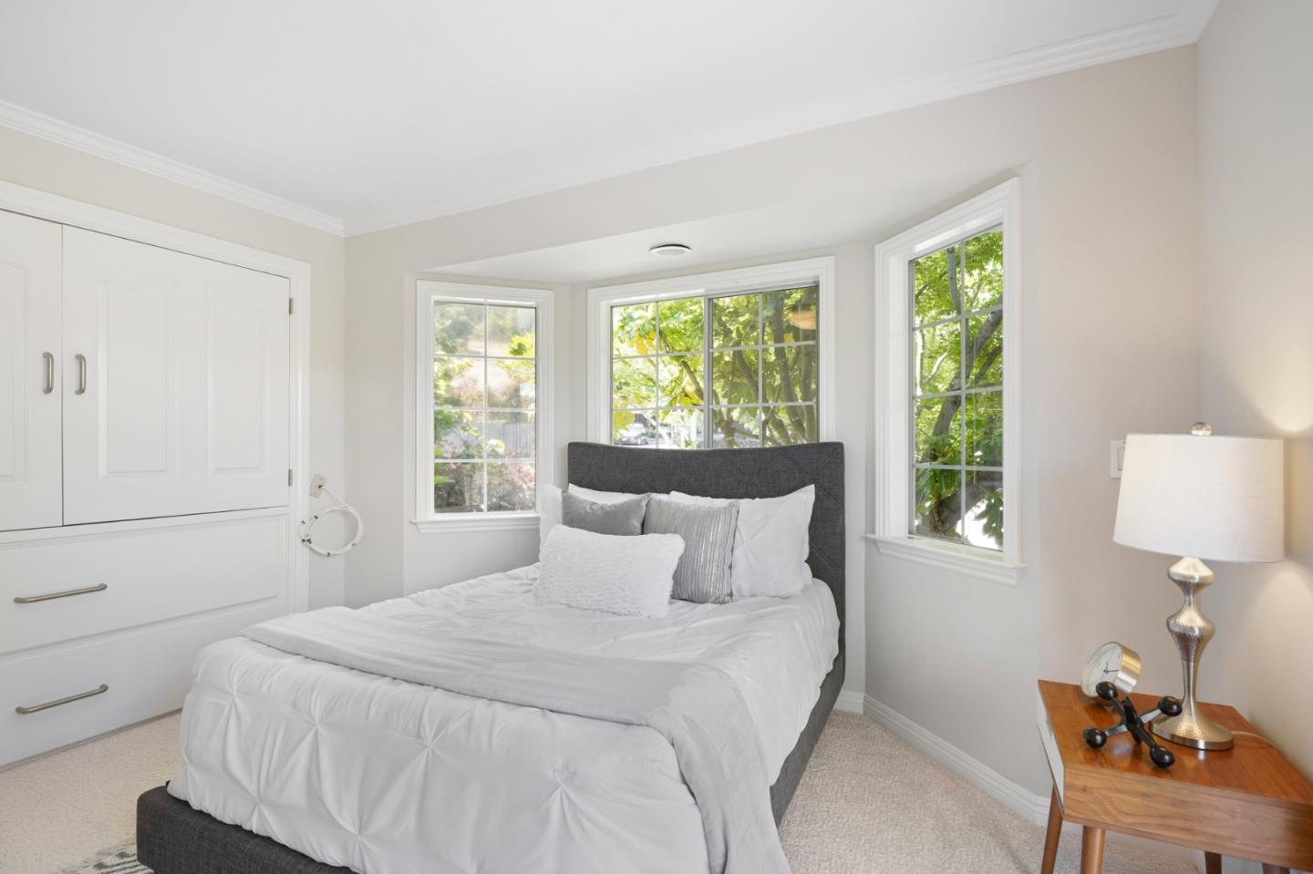 15 Debes Ranch Road San Rafael, CA 94903 - Photo 17 of 45 a bedroom with a bed and window with lamp