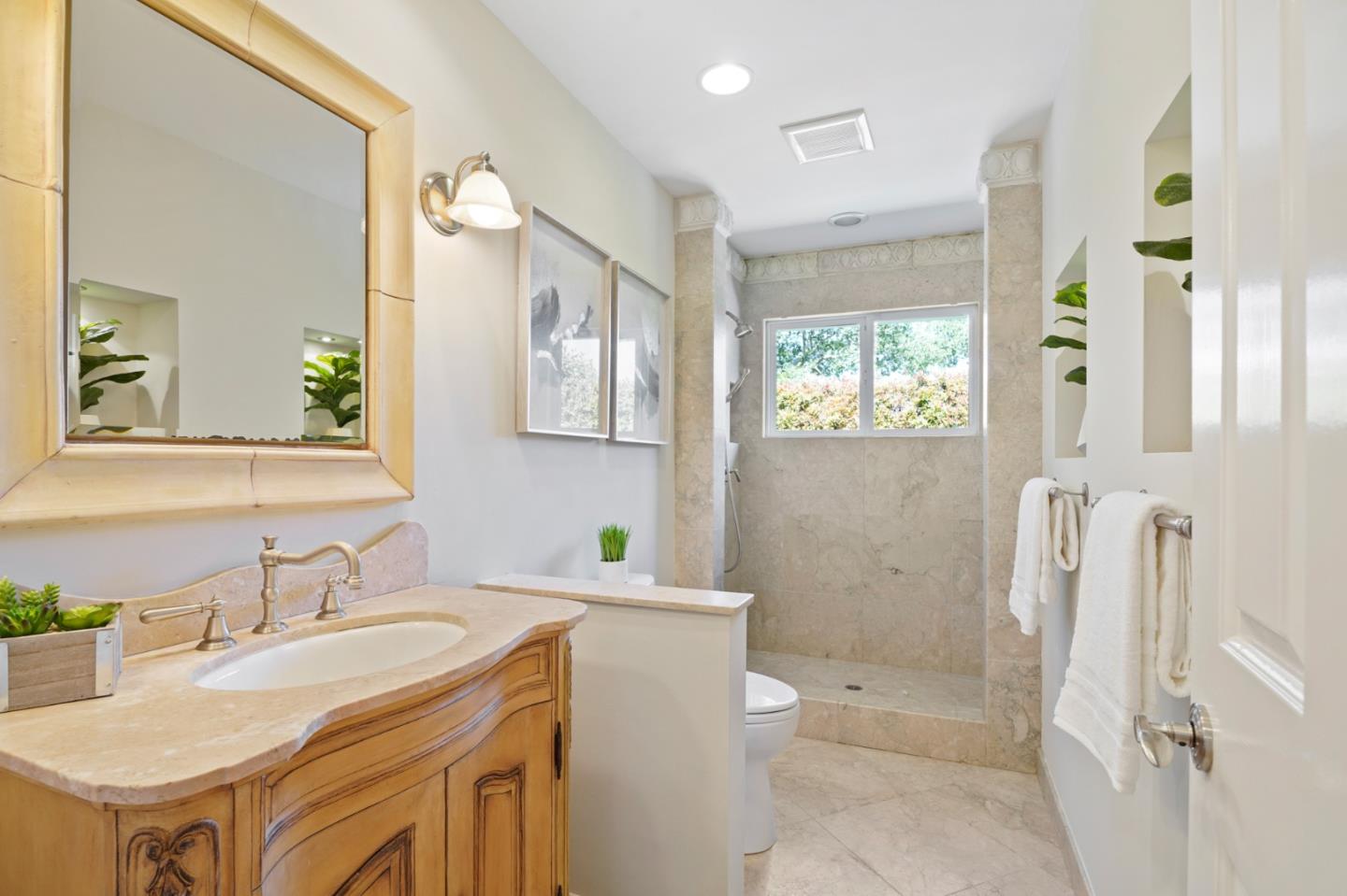 15 Debes Ranch Road San Rafael, CA 94903 - Photo 18 of 45 a bathroom with a sink toilet double vanity and tub