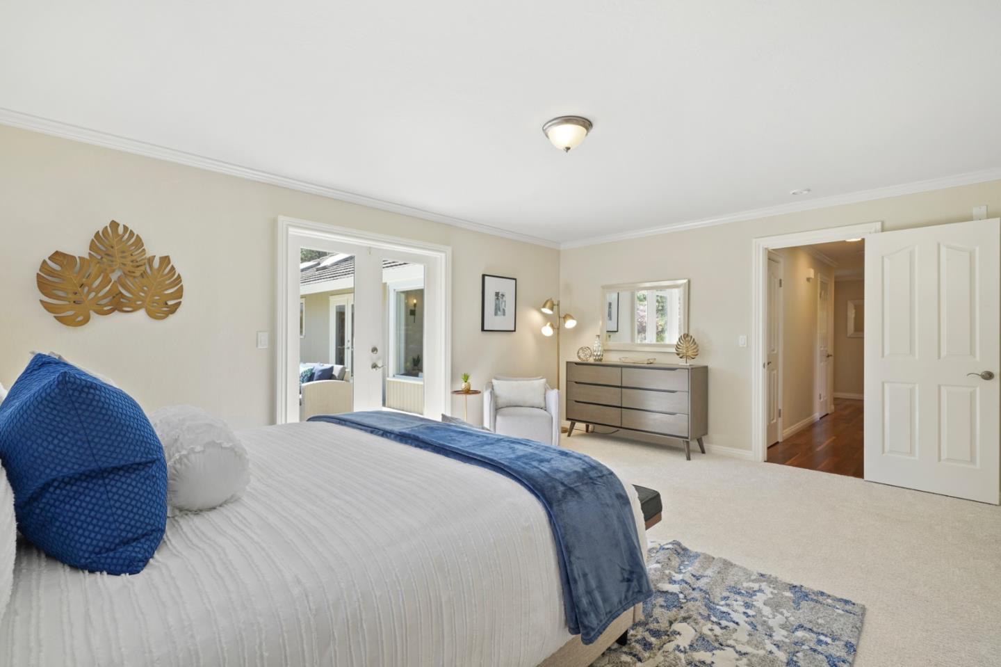 15 Debes Ranch Road San Rafael, CA 94903 - Photo 22 of 45 a bedroom with a bed and a chandelier
