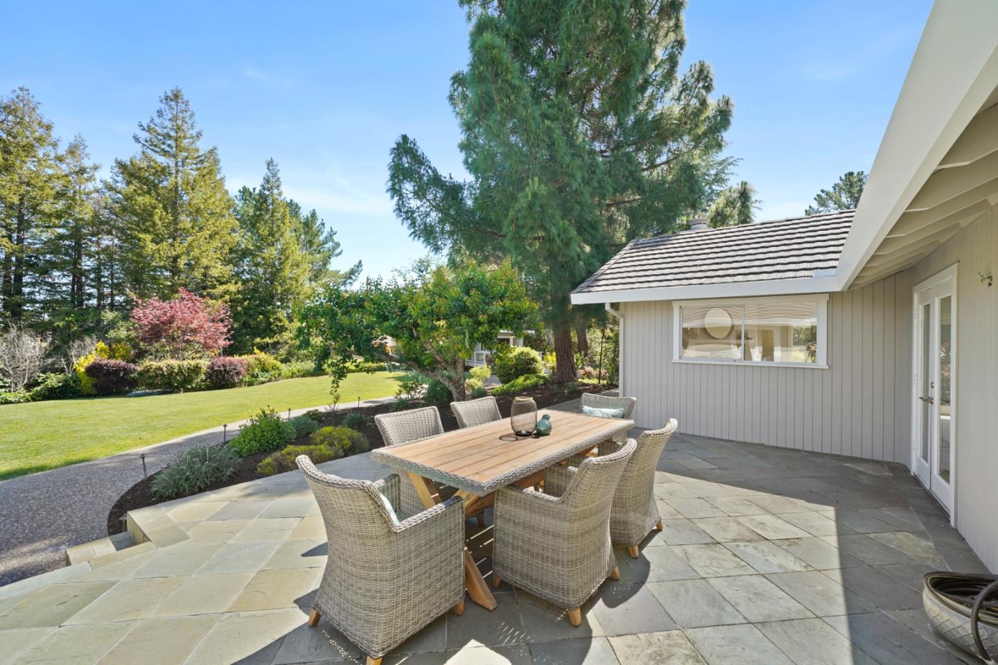 15 Debes Ranch Road San Rafael, CA 94903 - Photo 30 of 45 a view of a patio with table and chairs and potted plants