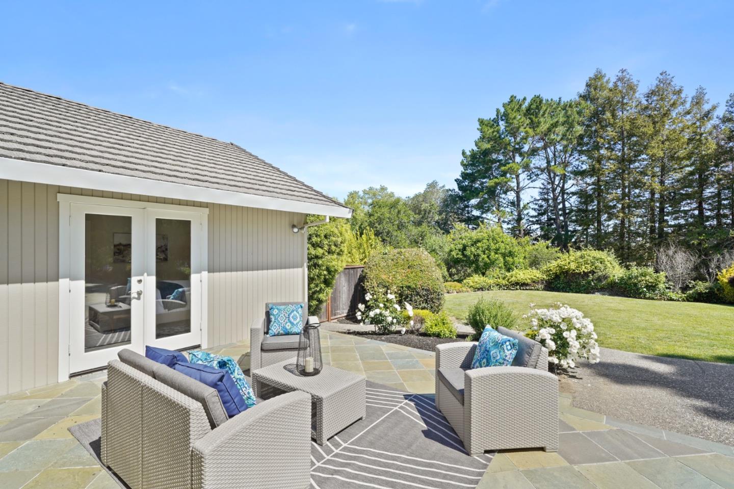 15 Debes Ranch Road San Rafael, CA 94903 - Photo 31 of 45 a view of a patio with couches and a table and chairs with garden view