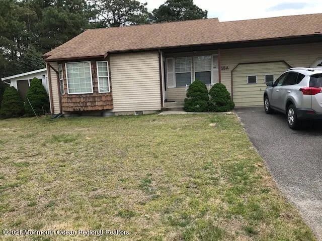 a couple of cars parked in front of house