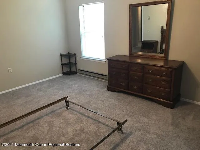 a view of a room with a dresser