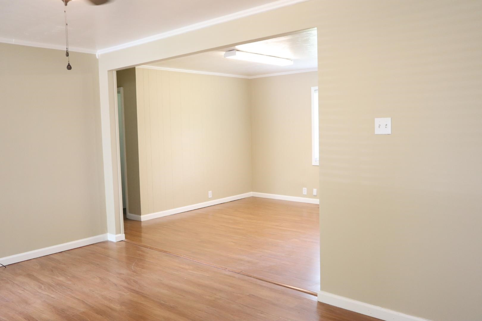 1801 Bailey Road Gadsden, TN 38337 - Photo 7 of 15 a view of an empty room with wooden floor and a window