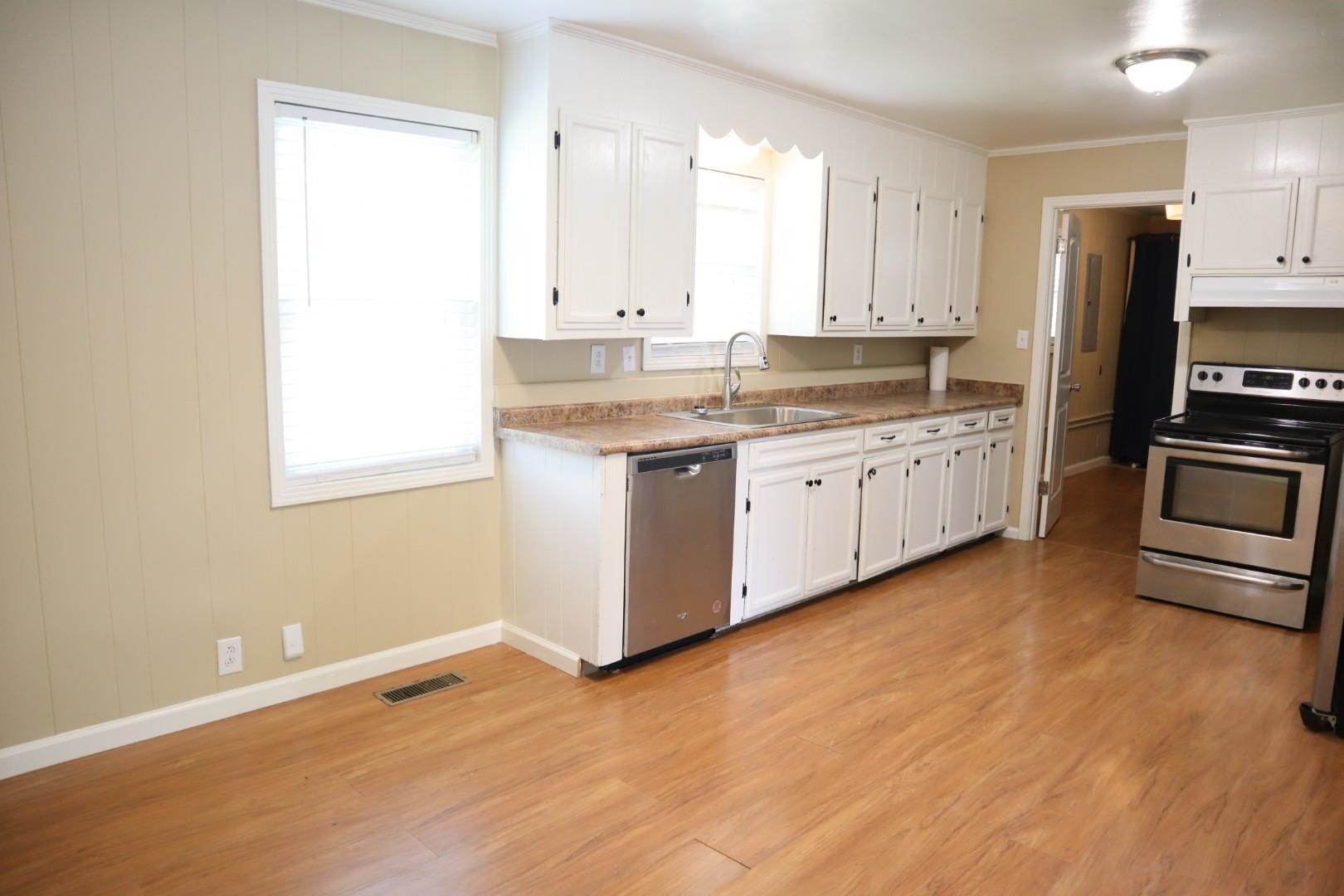 1801 Bailey Road Gadsden, TN 38337 - Photo 9 of 15 a kitchen with stainless steel appliances granite countertop a stove a sink and a refrigerator