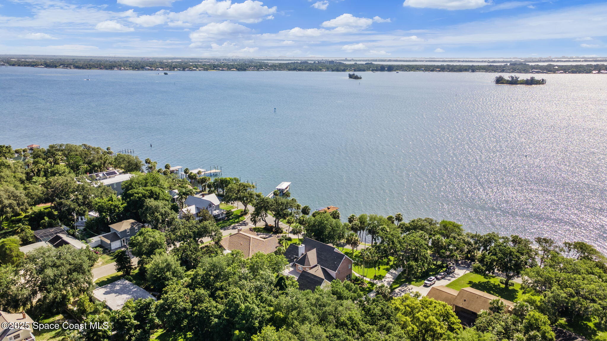 1407 Rockledge Drive Rockledge, FL 32955 - Photo 22 of 79 a view of a lake with a building in front of it
